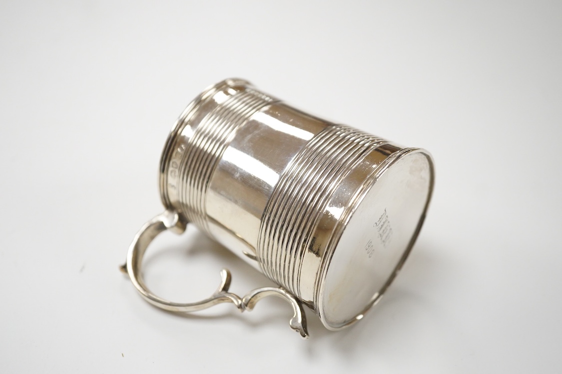 A William IV reeded silver christening mug, with later engraved initials and date to the base, Joseph Angell I & John Angell I, London, 1834, height 77mm, 3.9oz.